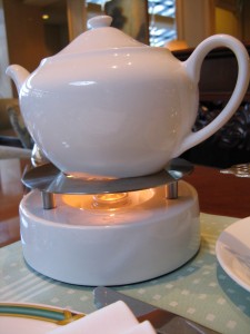 Narumi Bone China Teapot on its warming base (image credit: HighTea.com)
