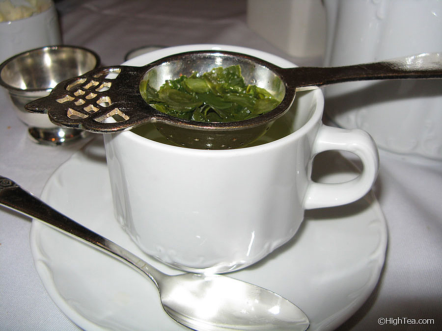 Japanese sencha green tea in tea strainer at Waldorf Astoria Hotel in New York City for afternoon tea