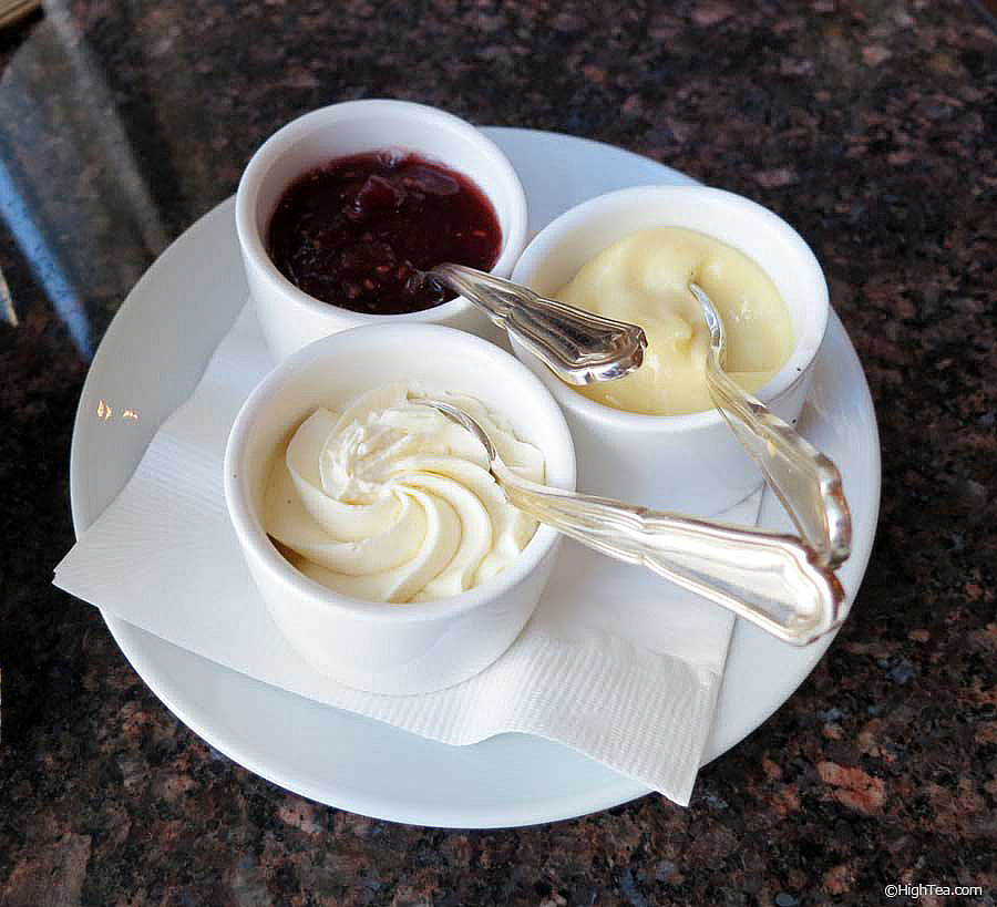 Lemon curd, Devonshire cream and housemade jams for scones at The Peninsula Chicago afternoon tea